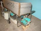 Used H Tech Vibratory Conveyor, Stainless Steel. 10-1/2'' Wide x 74'' long x 3'' high sides vibrating pan. Syntron speed controller. Mounted on a carbon steel base.