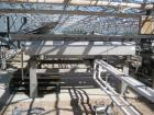 Used Lyco model 9000 vibratory conveyor 40 inches wide x 10 feet long, last used for pouches.