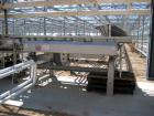 Used Lyco model 9000 vibratory conveyor 40 inches wide x 10 feet long, last used for pouches.