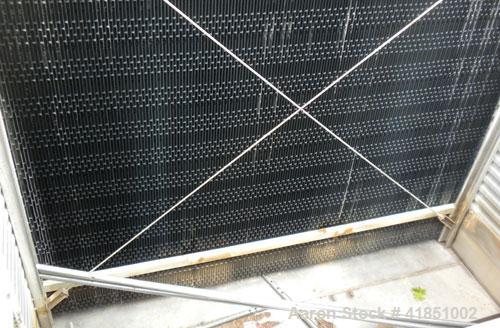 Used Baltimore Aircoil Series 3000 Induced Draft, Crossflow Single Cell Cooling Tower, Nominal 985 Tons, Model 3985A/V. Galvanized steel housing, 304 stainless steel cold water basin. Vertical air di...