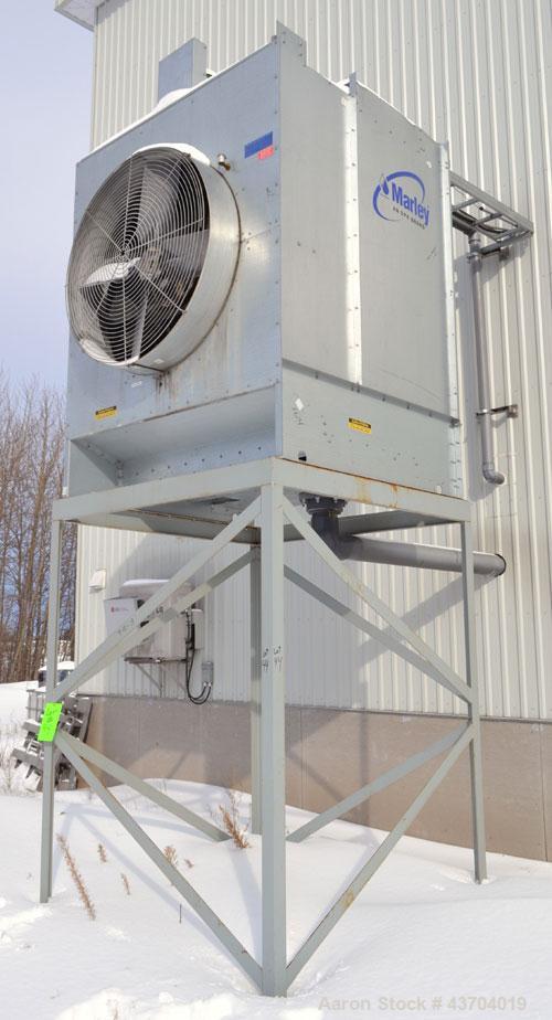 Used Marley cooling tower, 56 Tons, Model 494C. Galvanized housing, rated approximate 170 gallons per minute, 95 degrees F hot, 84 degrees F cold, 77 dgrees F entering wet bulb. Mounted on a frame. B...
