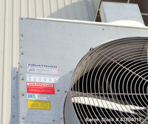 Used Marley cooling tower, 56 Tons, Model 494C. Galvanized housing, rated approximate 170 gallons per minute, 95 degrees F hot, 84 degrees F cold, 77 dgrees F entering wet bulb. Mounted on a frame. B...