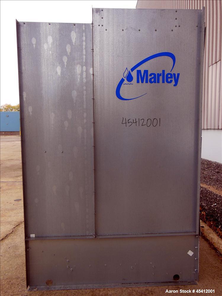 Used Marley Aquatower Single Cell Cooling Tower, Model 496B. Approximately 126 nominal tons, galvanized steel housing. Designed to cool 400 gallons per minute at 102 degrees F hot water, 87 degrees F...