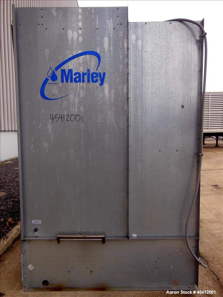 Used Marley Aquatower Single Cell Cooling Tower, Model 496B. Approximately 126 nominal tons, galvanized steel housing. Designed to cool 400 gallons per minute at 102 degrees F hot water, 87 degrees F...