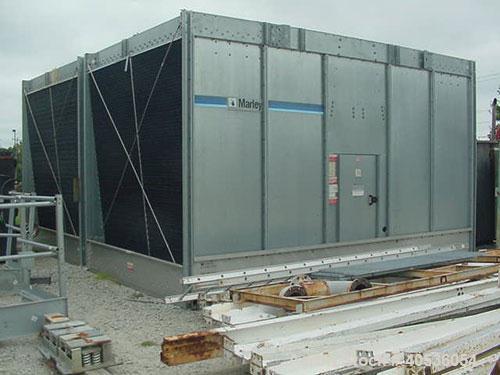 Used Marley Model NC5201CS Serial Cooling Tower, 403 ton. Cooling 1209 GPM of water from 95 deg F to 85 deg F at a 78 deg F wet bulb at 20 hp fan motor. Dimensions: 18'9" wide x 10'10 3/4" long x 12'...