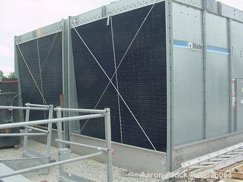 Used Marley Model NC5201CS Serial Cooling Tower, 403 ton. Cooling 1209 GPM of water from 95 deg F to 85 deg F at a 78 deg F wet bulb at 20 hp fan motor. Dimensions: 18'9" wide x 10'10 3/4" long x 12'...
