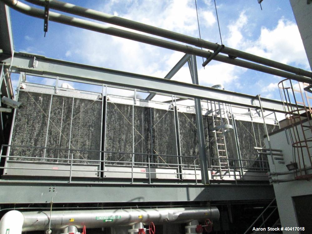 Used Marley Cooling Tower, Model NC8305BG, 450 ton, built 2006, hot and cold basins are stainless steel.