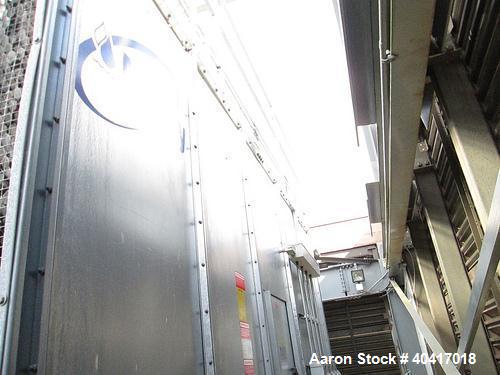 Used Marley Cooling Tower, Model NC8305BG, 450 ton, built 2006, hot and cold basins are stainless steel.