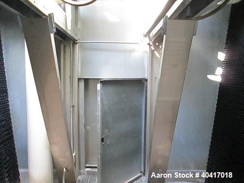 Used Marley Cooling Tower, Model NC8305BG, 450 ton, built 2006, hot and cold basins are stainless steel.