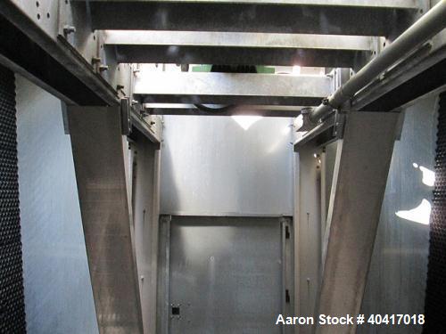 Used Marley Cooling Tower, Model NC8305BG, 450 ton, built 2006, hot and cold basins are stainless steel.