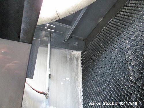 Used Marley Cooling Tower, Model NC8305BG, 450 ton, built 2006, hot and cold basins are stainless steel.