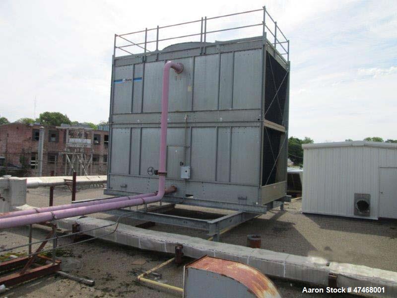 Used Marley Cooling Tower, Model NC 9201. 1200 gallons per minute of cooling water from 57 degrees F to 48 degrees F. Nominal rating 673 tons. Marley series 22.3 gear reducer, reduction ratio 6.12/1....
