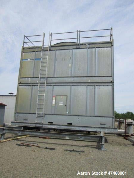 Used Marley Cooling Tower, Model NC 9201. 1200 gallons per minute of cooling water from 57 degrees F to 48 degrees F. Nominal rating 673 tons. Marley series 22.3 gear reducer, reduction ratio 6.12/1....