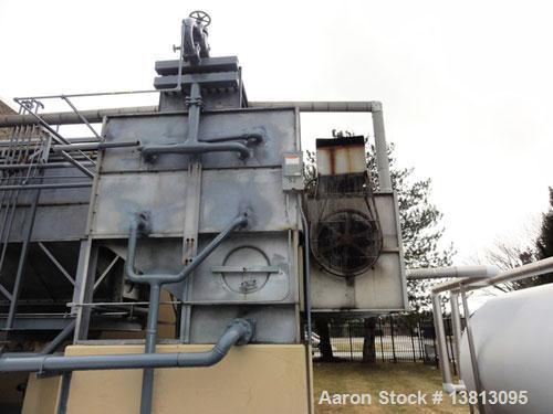 Used Mojonnier Cooling Tower, 180 ton, model AEC149.  Galvanized housing with super heater for additional refrigeration capacity.  Side mounted twin fans.