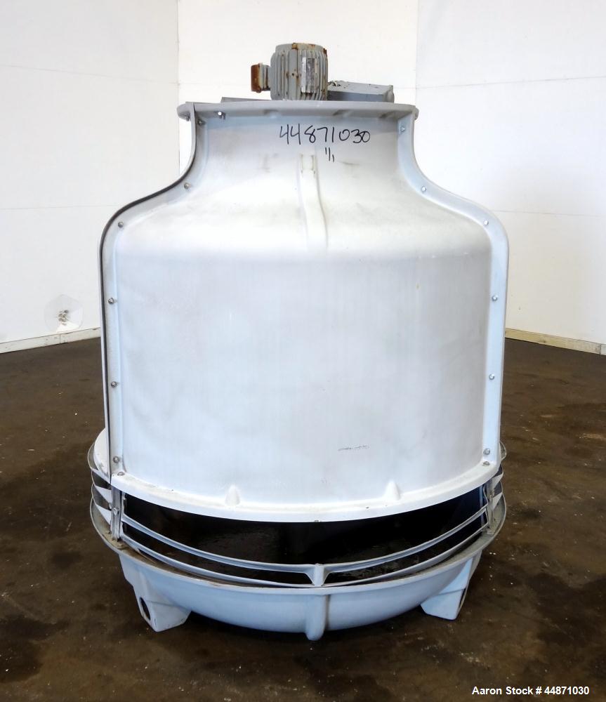 Used Thermal Care FT Series Cooling Tower, Fiberglass Construction. Cooling capacity 22 tons, nominal 66 gallons per minute. Includes an approximate 24" diameter top mounted fan, driven by a 1hp, 3/6...