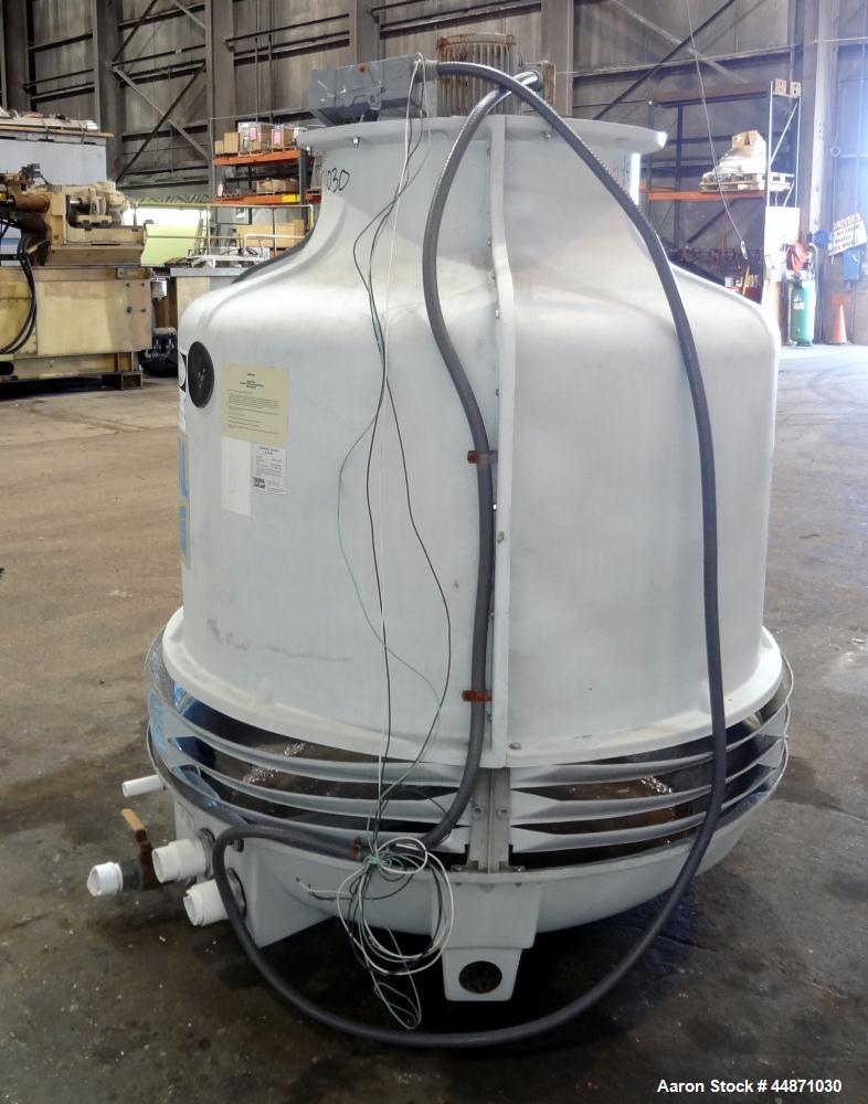 Used Thermal Care FT Series Cooling Tower, Fiberglass Construction. Cooling capacity 22 tons, nominal 66 gallons per minute. Includes an approximate 24" diameter top mounted fan, driven by a 1hp, 3/6...