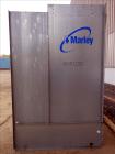 Used Marley Aquatower Single Cell Cooling Tower, Model 496B. Approximately 126 nominal tons, galvanized steel housing. Designed to cool 400 gallons per minute at 102 degrees F hot water, 87 degrees F...