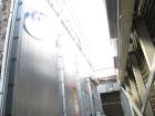 Used Marley Cooling Tower, Model NC8305BG, 450 ton, built 2006, hot and cold basins are stainless steel.