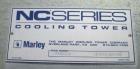 Used Marley Cooling Tower, Model NC 9201. 1200 gallons per minute of cooling water from 57 degrees F to 48 degrees F. Nominal rating 673 tons. Marley series 22.3 gear reducer, reduction ratio 6.12/1....