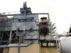 Used Mojonnier Cooling Tower, 180 ton, model AEC149.  Galvanized housing with super heater for additional refrigeration capacity.  Side mounted twin fans.