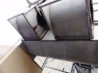 Used Mojonnier Cooling Tower, 180 ton, model AEC149.  Galvanized housing with super heater for additional refrigeration capacity.  Side mounted twin fans.