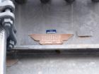 Used Mojonnier Cooling Tower, 180 ton, model AEC149.  Galvanized housing with super heater for additional refrigeration capacity.  Side mounted twin fans.