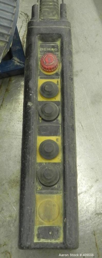 Used Demag 1/2 Ton Hoist, Chain 5 x 15. .85 KW, 3/50/415 Volt, 2770/665 RPM. Includes button controls.