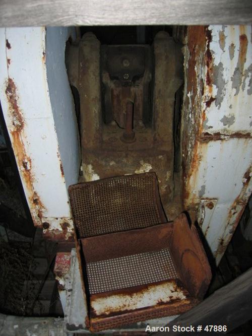 Used Bacon 6 x 3 Jaw Crusher, Carbon Steel. Approximate  5 hp drive. Mounted on a stand.