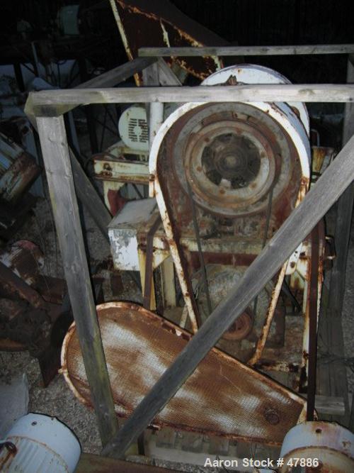 Used Bacon 6 x 3 Jaw Crusher, Carbon Steel. Approximate  5 hp drive. Mounted on a stand.
