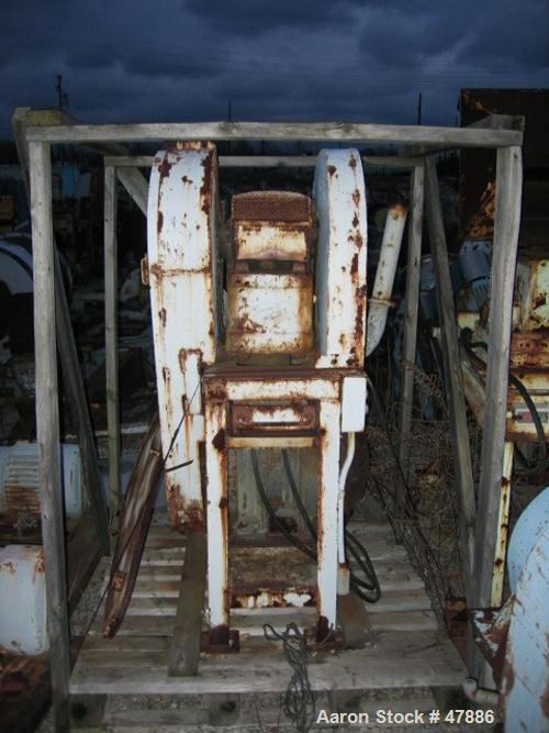 Used Bacon 6 x 3 Jaw Crusher, Carbon Steel. Approximate  5 hp drive. Mounted on a stand.