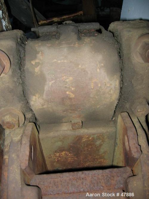 Used Bacon 6 x 3 Jaw Crusher, Carbon Steel. Approximate  5 hp drive. Mounted on a stand.
