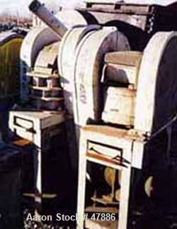 Used Bacon 6 x 3 Jaw Crusher, Carbon Steel. Approximate  5 hp drive. Mounted on a stand.