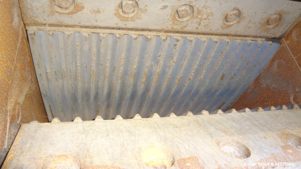 Used Kue Ken Jaw Crusher, Model 10 X 36, Carbon Steel.  Approximate feed 10” x 36”. Capacity in short tons per hour 1” at 32-50, 3” at 95-135.  Requires motor.  RPM range 350-390.