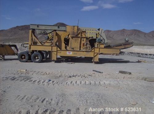 USED: Kue-Ken 25 x 42 Big Bite portable jaw crusher with SimplicityEngineering 46 x 16 VGF removable feeder hopper. 42" under jaw belt.Internal mechanical lube system with external filter.
