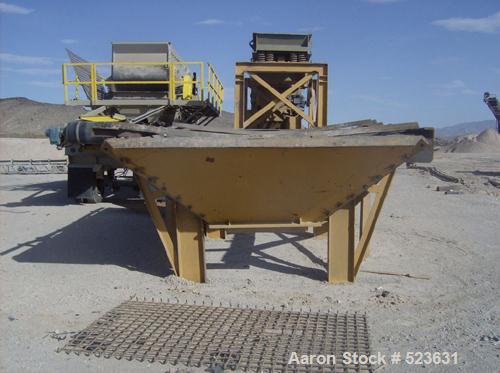 USED: Kue-Ken 25 x 42 Big Bite portable jaw crusher with SimplicityEngineering 46 x 16 VGF removable feeder hopper. 42" under jaw belt.Internal mechanical lube system with external filter.