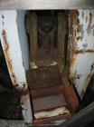 Used Bacon 6 x 3 Jaw Crusher, Carbon Steel. Approximate  5 hp drive. Mounted on a stand.