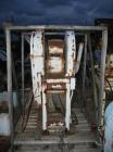 Used Bacon 6 x 3 Jaw Crusher, Carbon Steel. Approximate  5 hp drive. Mounted on a stand.