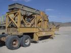 USED: Kue-Ken 25 x 42 Big Bite portable jaw crusher with SimplicityEngineering 46 x 16 VGF removable feeder hopper. 42