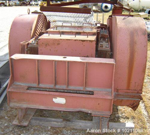 Used Gruendler Dual Roll Crusher.  Rolls are 24" wide X approximately 16" diameter. Each roll is driven by a separate 15 hp, 460 volt AC motor with belt drive mechanism. Unit comes with two electrica...
