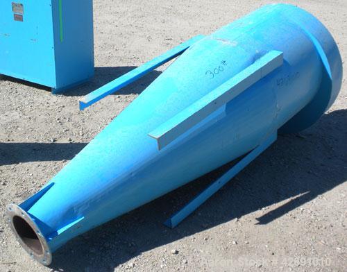 Used Cyclone, Carbon Steel. Approximately 42" diameter x 33" straight side x 67" coned bottom. 5" Air inlet, 9" center bottom outlet, 16-1/2" top air outlet with a 4 sock filter system.