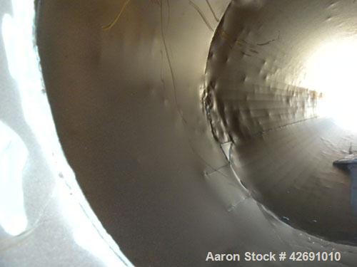 Used Cyclone, Carbon Steel. Approximately 42" diameter x 33" straight side x 67" coned bottom. 5" Air inlet, 9" center bottom outlet, 16-1/2" top air outlet with a 4 sock filter system.