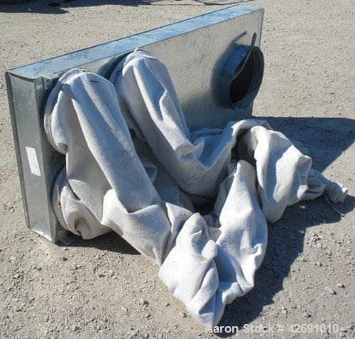 Used Cyclone, Carbon Steel. Approximately 42" diameter x 33" straight side x 67" coned bottom. 5" Air inlet, 9" center bottom outlet, 16-1/2" top air outlet with a 4 sock filter system.
