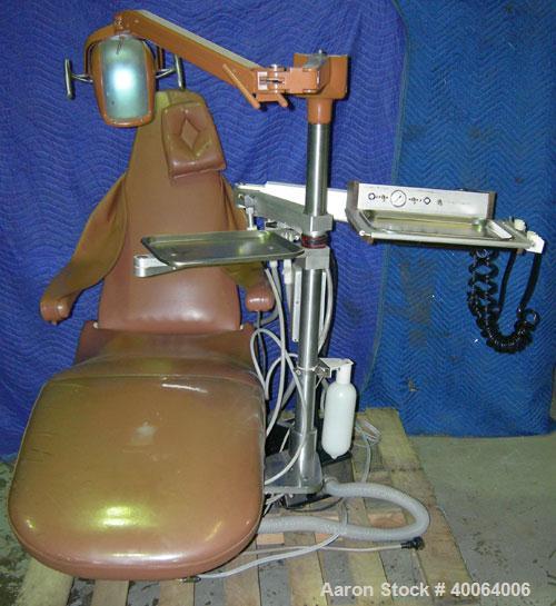 Used: Dental EZ Operatory Dental Chair, Model JS. Includes foot pedal controls, A-DEC delivery station, power source, and a A-DEC model LF light. 
