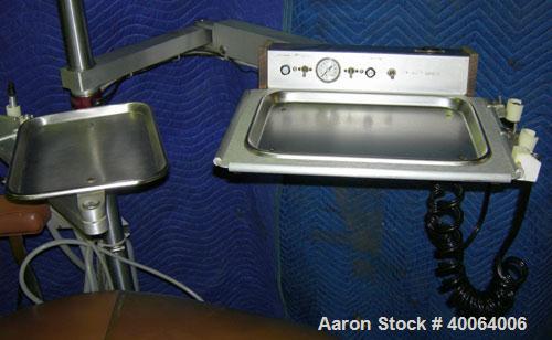 Used: Dental EZ Operatory Dental Chair, Model JS. Includes foot pedal controls, A-DEC delivery station, power source, and a A-DEC model LF light. 
