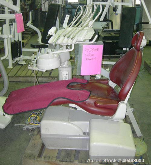 Used PROMA/ ADEC dental chair (red) with unattached light, attached sink and attached tray.