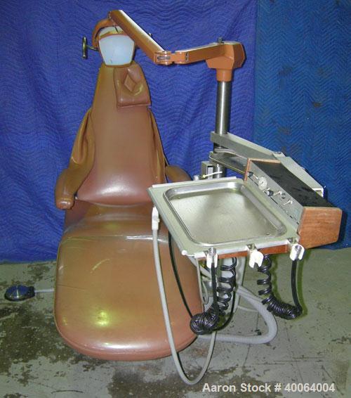 Used: Dental EZ Operatory Dental Chair, Model JS. Includes foot pedal controls, A-DEC delivery station, power source, and a Pelton and Crane light.