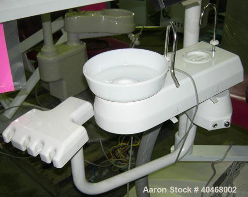 Used Proma dental chair, model XL. 60 hz, 120 volt, 6.9 amp max. Includes foot pedal controls, light, tool tray and cuspidor. UL Listed.
