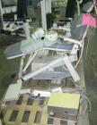 Used ADEC dental chair (gray) with unattached tray, ADEC light, and unattached Elitys X-ray machine with control panel.