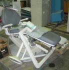 Used ADEC dental chair (gray) with unattached tray, ADEC light, and unattached Elitys X-ray machine with control panel.