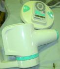 Used ADEC dental chair (gray) with unattached tray, ADEC light, and unattached Elitys X-ray machine with control panel.